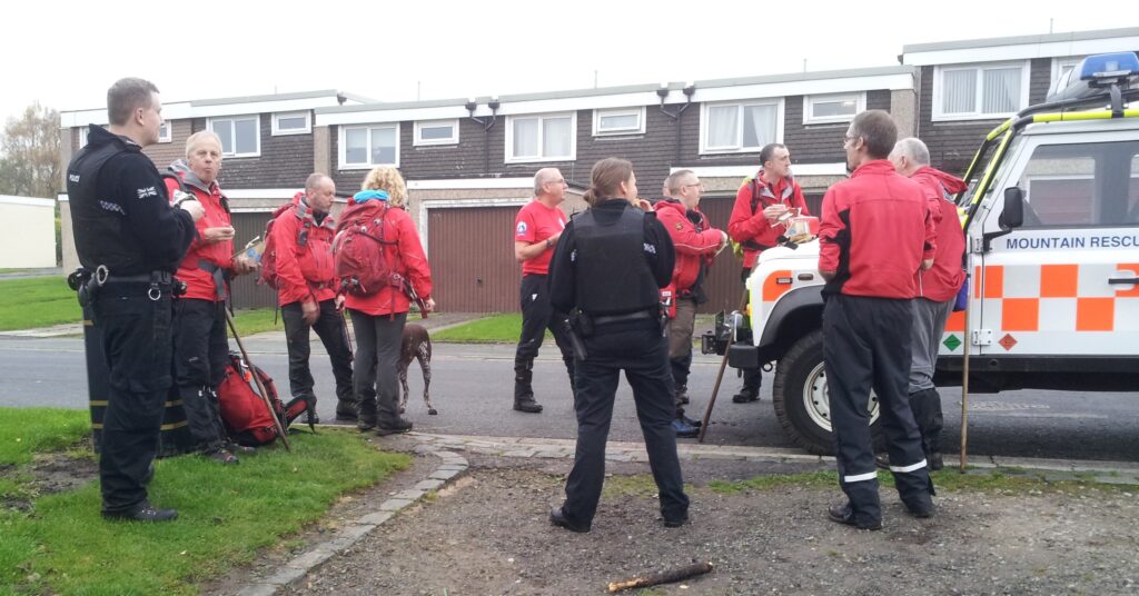 Team members and Lancashire Constabulary officers stop for a refreshment break during the search